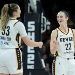 Caitlin Clark celebrates with Indiana Fever teammate Katie Lou Samuelson during a 99-80 loss to the Las Vegas Aces on May 25.