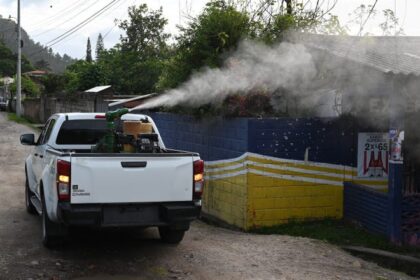 A state vehicle spray to combat the Aedes aegypti mosquito that transmits dengue fever during a fumigation operation in Tegucigalpa, Honduras, on July 12, 2024.