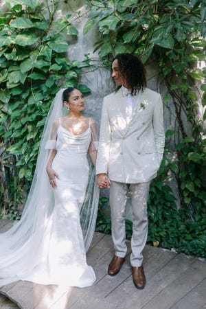 Vanessa Hudgens wears custom Vera Wang in her wedding to baseball player Cole Tucker.