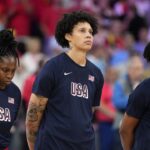 United States' Brittney Griner, center, stands on the court during the national anthem prior to a women's basketball game against Belgium at the 2024 Summer Olympics, Thursday, Aug. 1, 2024, in Villeneuve-d'Ascq, France. (AP Photo/Michael Conroy)