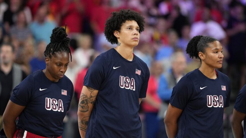 United States' Brittney Griner, center, stands on the court during the national anthem prior to a women's basketball game against Belgium at the 2024 Summer Olympics, Thursday, Aug. 1, 2024, in Villeneuve-d'Ascq, France. (AP Photo/Michael Conroy)