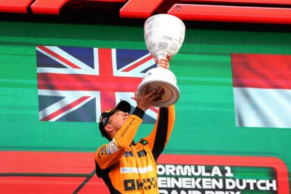 McLaren's Lando Norris celebrates on the podium after winning the Dutch Grand Prix.