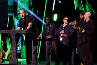 CLEVELAND, OHIO - OCTOBER 19: Dave Matthews, Buddy Strong, Rashawn Ross and Jeff Coffin speak onstage during the 2024 Rock & Roll Hall Of Fame Induction Ceremony streaming on Disney+ at Rocket Mortgage Fieldhouse on October 19, 2024 in Cleveland, Ohio. (Photo by Theo Wargo/Getty Images for The Rock and Roll Hall of Fame)