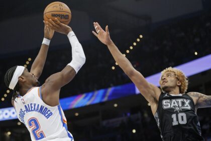 Oklahoma City Thunder guard Shai Gilgeous-Alexander (2) shoots against San Antonio Spurs forward Jeremy Sochan (10) during the second half of an NBA basketball game, Wednesday, Oct. 30, 2024, in Oklahoma City. (AP Photo/Nate Billings)